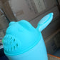 Soft blue Baby Shampoo Shower Cup with playful cartoon accents, designed to make hair washing fun for kids.