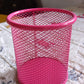 Lifestyle shot of the metal mesh desk organizer holding pens and markers.
