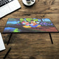 A vibrant cartoon-printed kids study table with foldable legs, perfect for learning and play.