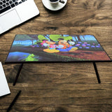 A vibrant cartoon-printed kids study table with foldable legs, perfect for learning and play.