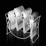 24-piece stainless steel cutlery set with elegant storage stand on table