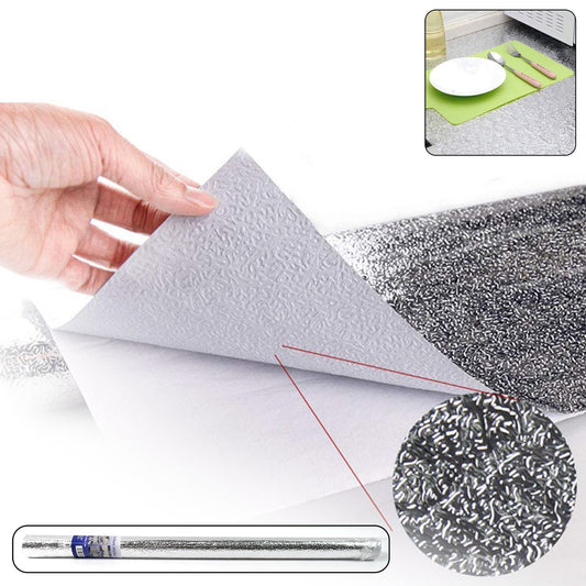 Roll of self-adhesive aluminium kitchen foil for surface protection.