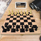Folding wooden chess set by Boardoria, with the board closed and pieces stored inside.