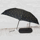 Compact umbrella with UV shield and zip case, displayed open for sun and rain protection.