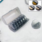 FERVENT Weekly Pill Organizer with 7 rainbow-colored daily boxes inside a clear case.