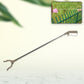 Close-up of the flexible claw mechanism of the garbage picker tool.