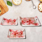 Close-up of the elegant floral printed design on a large plastic serving tray.