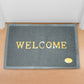 A stylish Welcome Door Mat in a neutral tone, designed for Indian home entrances.