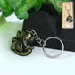 Front view of Ganesh Face Antique Black Metal Keychain showing detailed Ganesh design