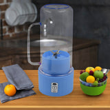 Portable electric juicer with handle and straw for fresh drinks.