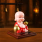 Colourful Solar Buddha Car Ornament with a gently nodding head, perfect for dashboard decor.