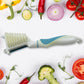 An Indian chef using the multipurpose peeler brush to prepare vegetables efficiently.