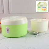 Green electric yogurt maker on a kitchen counter, ready to make homemade curd.