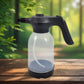 Electric garden sprayer, 2L capacity, shown in use for plant watering.