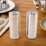 Stainless steel salt and pepper shaker set with brushed finish on kitchen table
