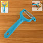 Close-up of the Y-shaped vegetable peeler, highlighting its sharp serrated blade.