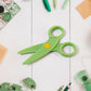 Plastic safety scissors with bright colorful handles designed for preschoolers