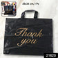 Side view of reusable Thank You printed carry bag for shopping and gifts