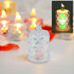 Single LED tealight candle illuminating a dark setting with a soft, inviting light.