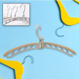 Portable folding clothes hanger in full view, ready for use.