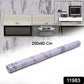 Close-up showing white and grey marble pattern on peel and stick kitchen wallpaper