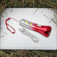 Portable LED torchlight resting on a flat surface, ready for use.
