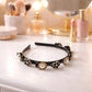 Elegant pearl and floral hairband with pearl studs and flower detailing