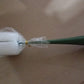 Ergonomic long handle bottle brush demonstrating its reach into a narrow-necked bottle.