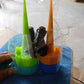 Self-Watering Spikes in use with various bottle sizes.