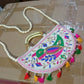 Lifestyle shot of the colorful Rajasthani handbag, perfect for everyday ethnic wear.