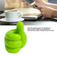 Key clipped securely on green hand-shaped wall holder