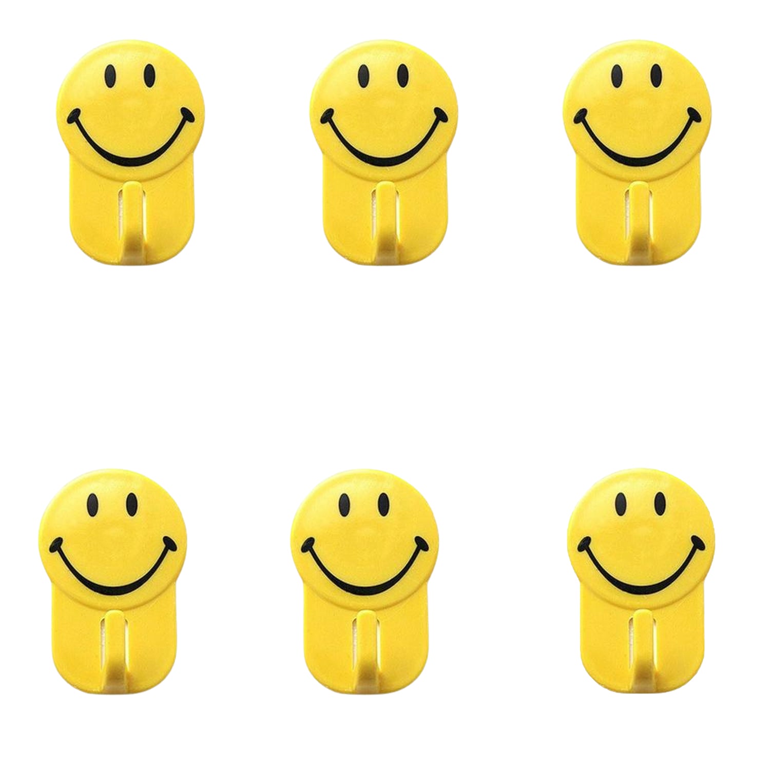Close-up of a plastic smiley face hook demonstrating its self-adhesive backing.