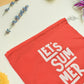 Red heavy-duty drawstring bag open, ready to store various items.