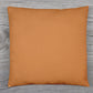 A beige couch pillow cover with an invisible zipper closure for easy use.