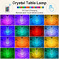 A person touching the top of the Crystal Touch Lamp to change its color.