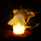 Set of 12 battery operated LED tealight candles with decorative golden net covers