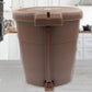 Sleek mini pedal dustbin discreetly positioned in an office workspace.