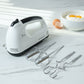Electric hand mixer set with stainless steel beaters and dough hooks on countertop