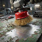 Wire brush cleaning rust from metal surface