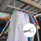 Close-up of the retractable clothing hook rod mechanism and handle.
