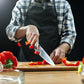 Reversible wooden slicing board with a prominent handle for easy grip.