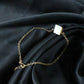 Side angle of elegant chain bracelet with square stone charm