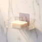 Two clear plastic transparent soap holders side by side for bathroom storage