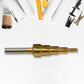 The versatile Step Drill Bit by Wagtail shown against a blurred workshop background.