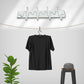 Adjustable wall hook holding various kitchen utensils, showcasing its versatility.