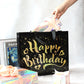 Close-up of golden star design on black reusable birthday gift bag