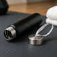 Matte black stainless steel water bottle with secure screw-top lid and strap