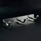 Polished metallic 3 hook rack mounted on bedroom wall