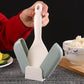 Close-up of automatic lid opening mechanism on rice spoon holder