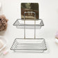 Wall mounted stainless steel soap dish with dual hooks in a modern bathroom.